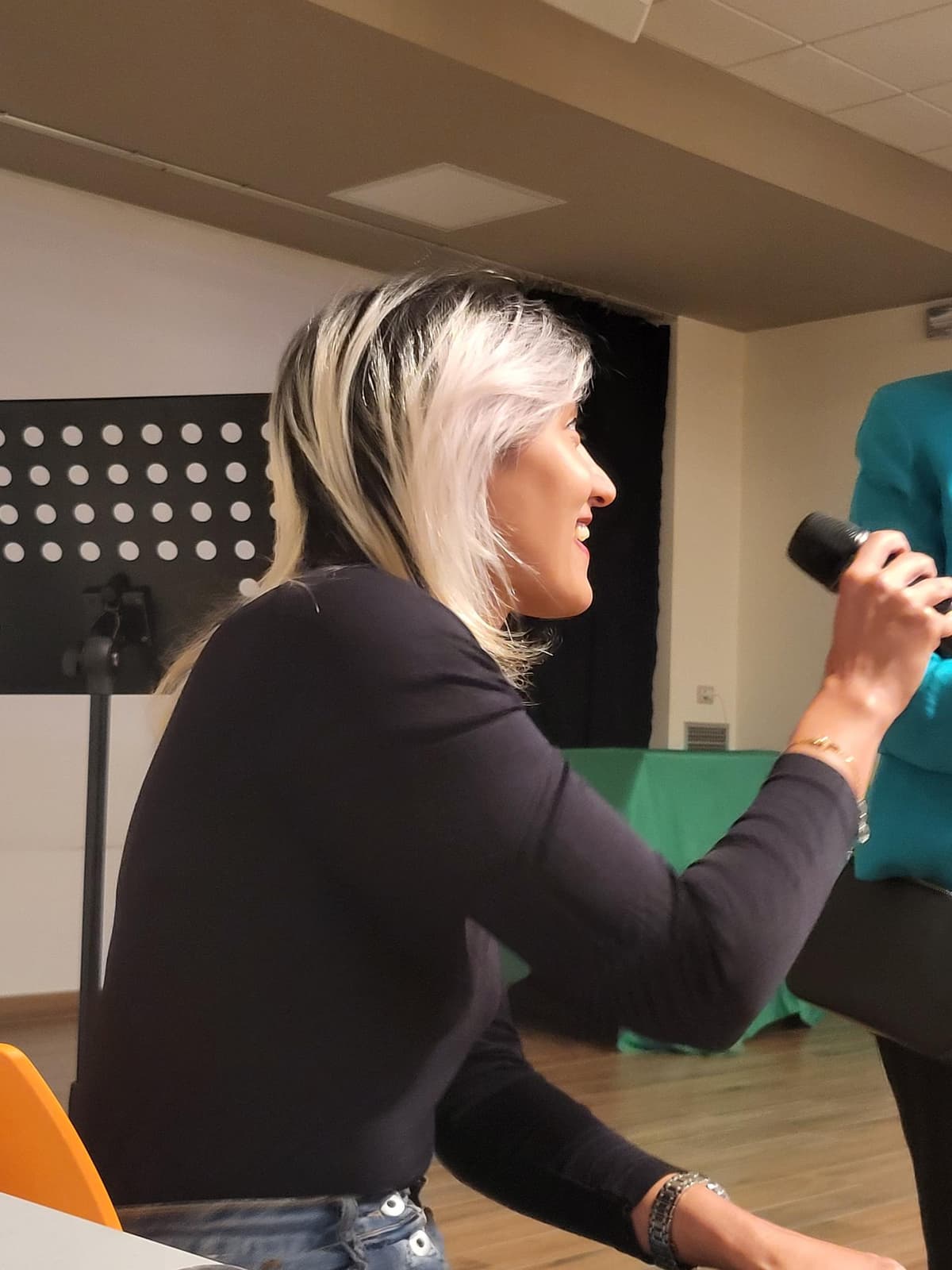 Dr. Hamideh Saberi speaking at a conference